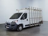 a picture of a white truck with a cage on the back of it