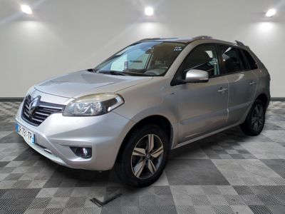 a picture of a silver car that is parked in a garage