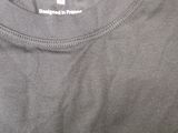 a close up of a black shirt with a white logo on it