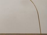 a brass floor lamp with a marble base and a white marble base