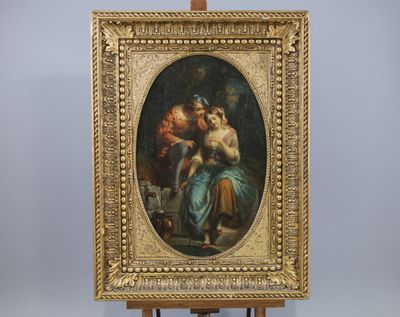 an oil painting of a woman holding a child on a easel