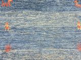 a close up of a blue and red rug with a pattern on it