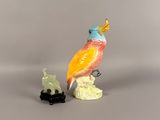 figurine of a bird and a cat on a white surface