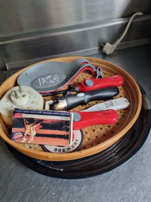a basket full of tools sitting on a counter