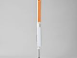 an orange and white lamp on a metal stand with a cord