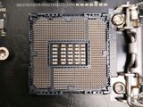 a close up of a motherboard with a cpu chip on it
