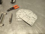 a pair of scissors and a pair of pliers on a table