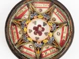 a picture of a small decorative object on a white surface