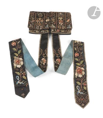 three pieces of black and blue silk with floral designs on them