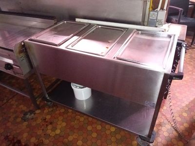 a picture of a commercial kitchen with a lot of food in it