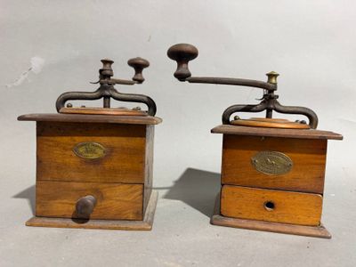 pair of antique wooden coffee grinders with brass handles