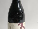 a bottle of wine that is sitting on a table