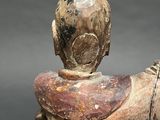 a statue of a man riding a horse with a saddle