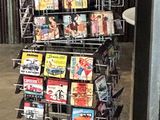 an image of a magazine rack in the corner of a store