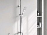 a close up of a shower head with a shower head and hand shower