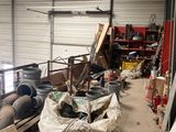 a large pile of junk in a warehouse with a lot of boxes