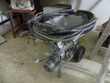 an image of a toilet with a hose attached to it