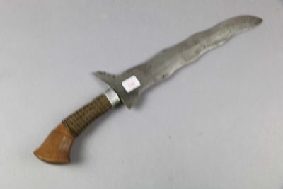 a knife that is laying on a table