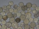 a lot of coins that are sitting on a table