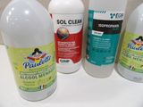 three bottles of toilet cleaner sitting on top of a white counter