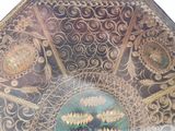 a large decorative plate with a picture of a man on it