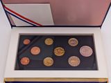 an image of a box with a few different coins inside of it