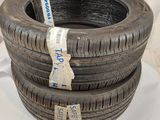 three tires stacked on top of each other on a white surface