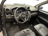 a picture of a car dashboard with a steering wheel and dashboard controls