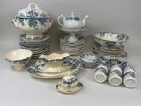 many plates and cups and saucers with blue flowers on them