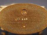 a close up of a gold plate with a star on it