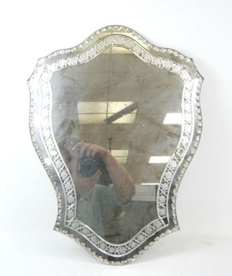 a woman taking a picture of herself in a mirror