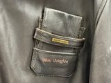 a black leather jacket with a pocket on it