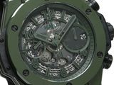 the watch is green and black with a black rubber band