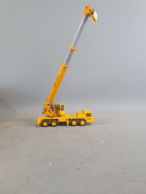 a toy truck with a crane on top of it