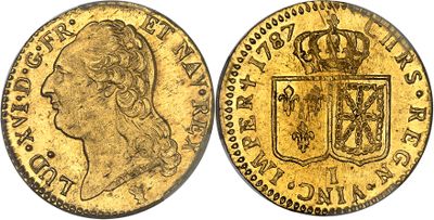 une pièce souveraine en or surmontée d'une couronne
