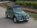 a small car that is parked on the side of the road