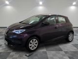 a picture of a purple car parked in a garage