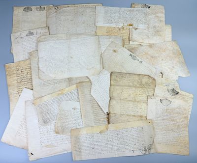 several pieces of old papers are piled on top of each other