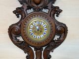 a clock hanging on the wall in the corner of the room
