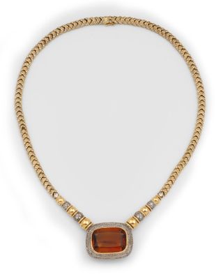 a yellow gold necklace with an orange stone and diamonds