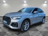 a silver audi qx parked on a checkered floor