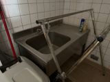 a bathroom with a sink and a toilet in it