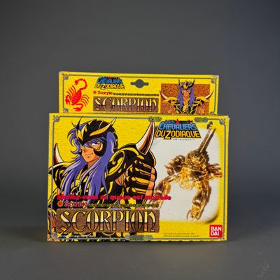 two boxes of card games are sitting on a gray surface