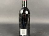 a bottle of wine that is sitting on a table