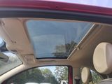 a view of the sunroof of a car from inside the vehicle