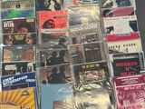 a lot of cds and cds on the table
