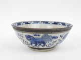 blue and white bowl with a horse design on the side