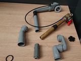 a lot of pipes and fittings on a table