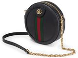 a black round bag with a gold chain strap and a green, red, and green stripe