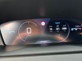 the dashboard of a car with a digital display on it